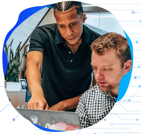 Technology consultants collaborating at a workstation